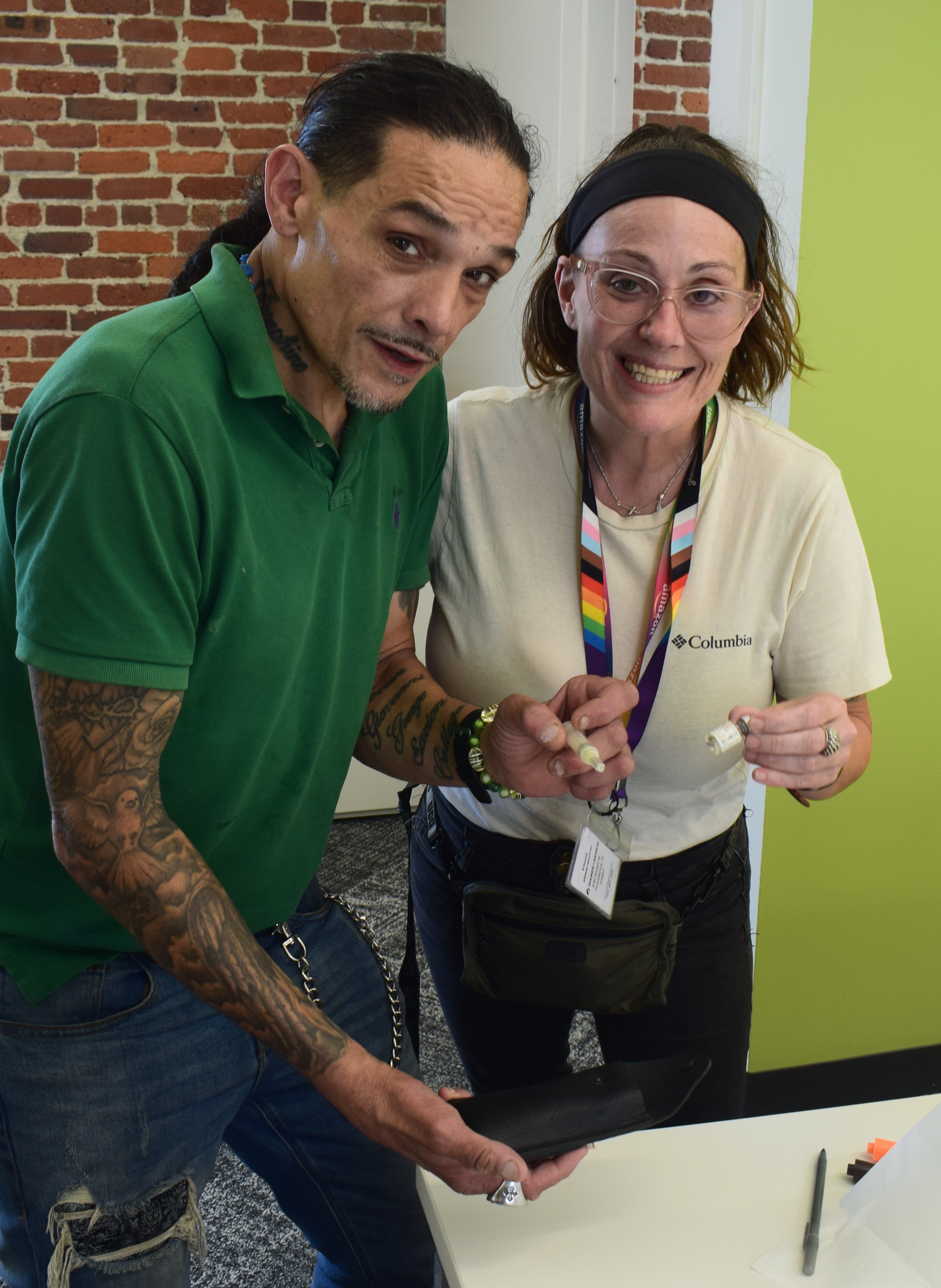 Participants at COBRE naloxone research project examining prototypes